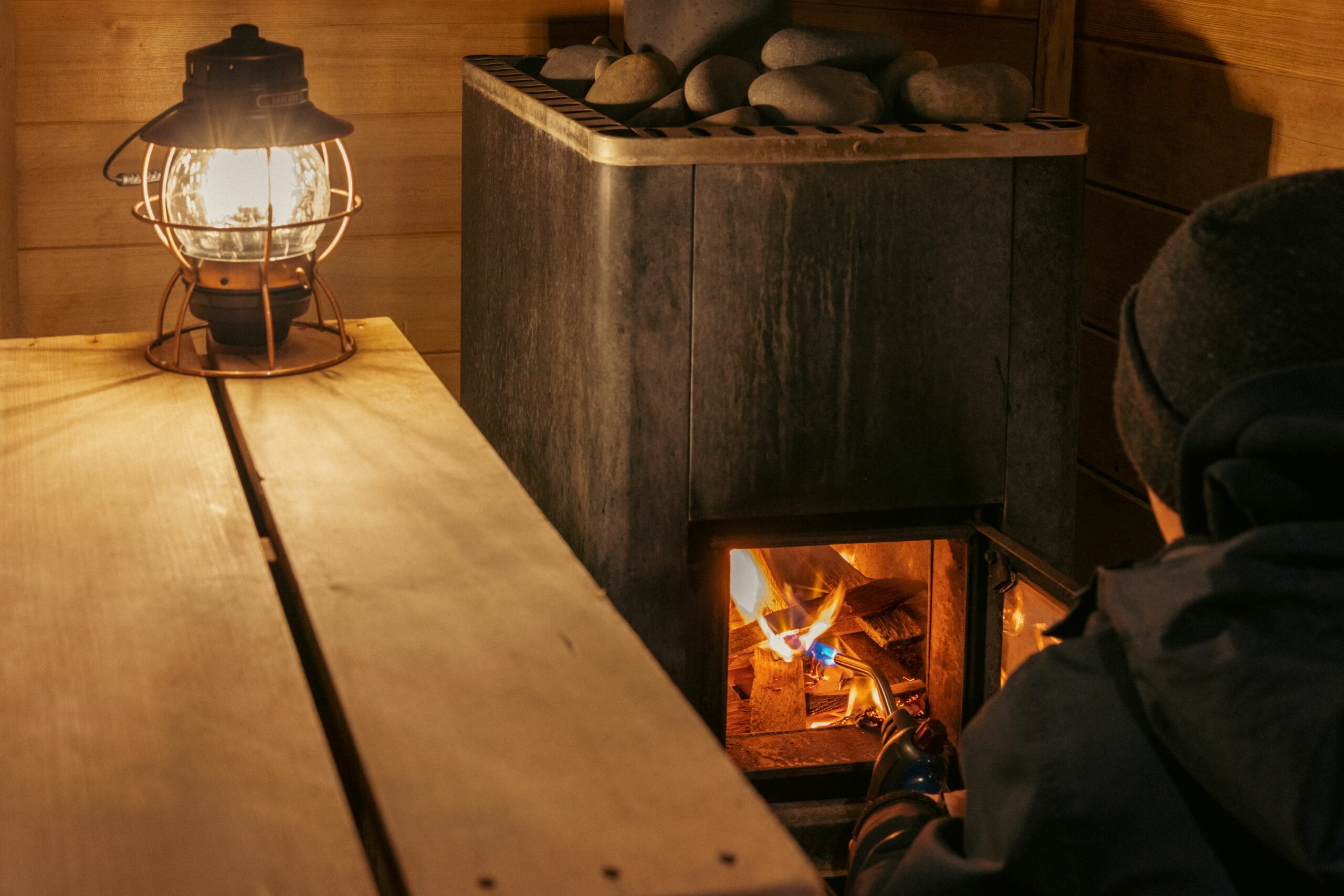 starting a sauna stove inside a sauna